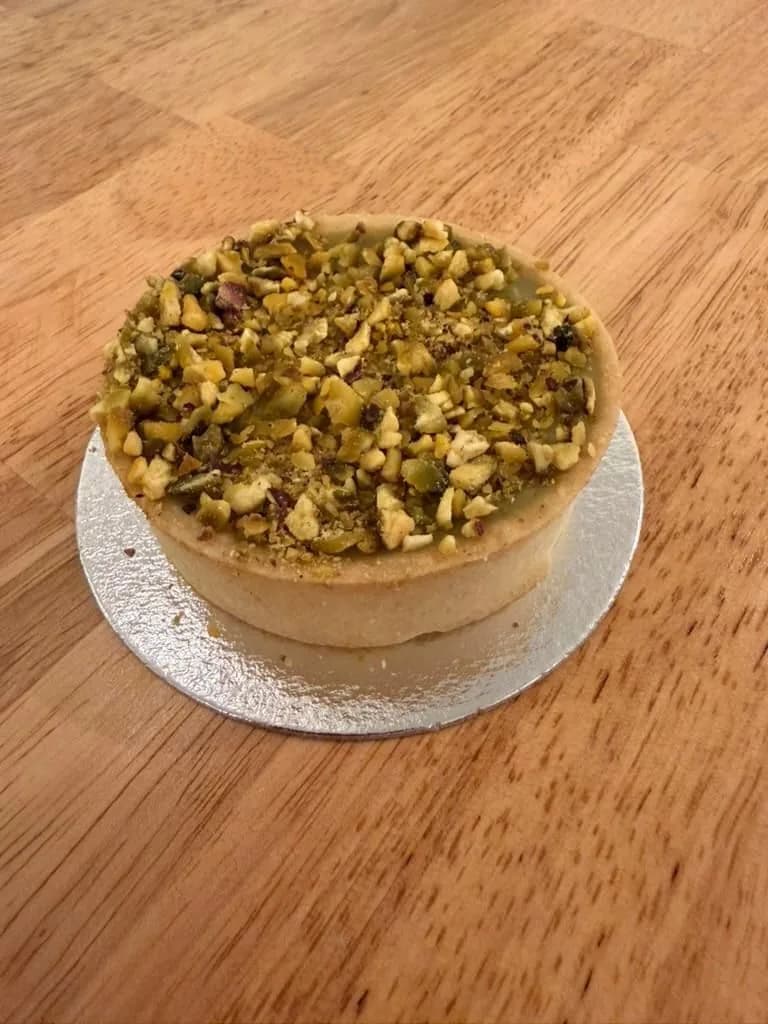 Pistachio tart on a silver board