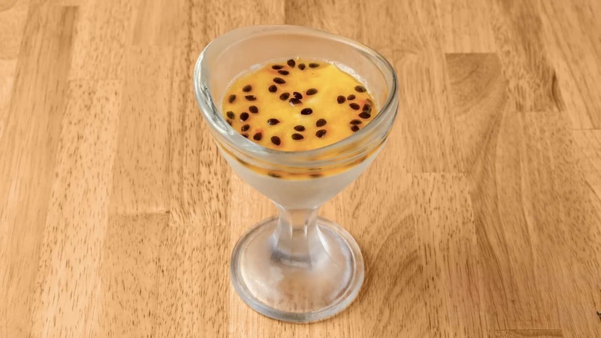 Passion fruit mousse served in a glass dessert cup at Floré Café & Kitchen