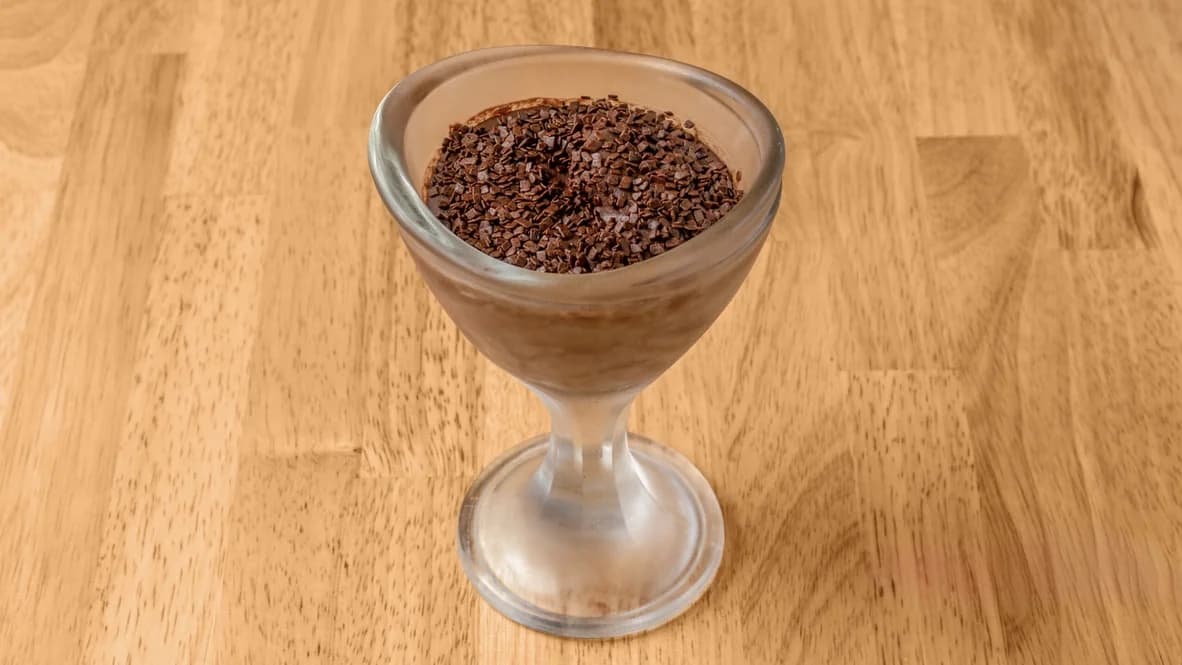 Chocolate mousse served in a glass dessert cup, topped with chocolate sprinkles, at Floré Café & Kitchen