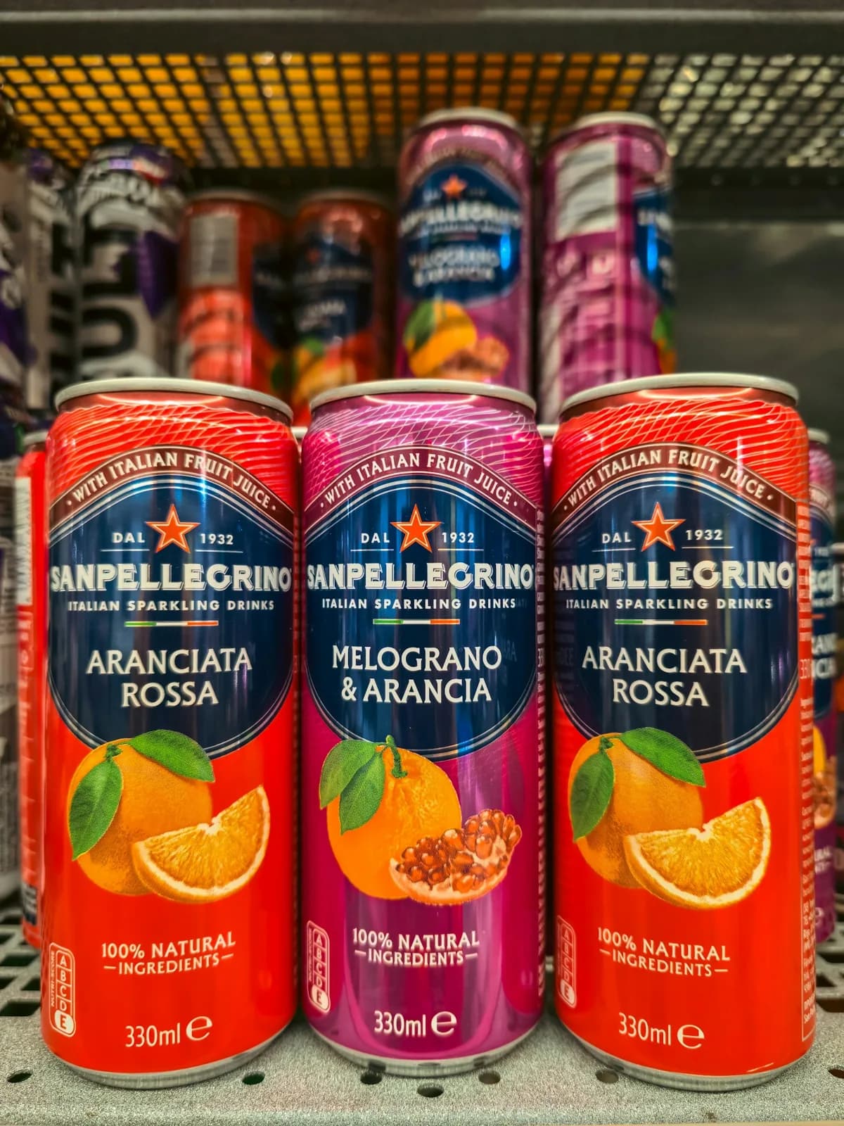 Sanpellegrino sparkling fruit drink cans in assorted flavors at Floré Café & Kitchen | Latas de bebida gaseificada Sanpellegrino em sabores variados no Floré Café & Kitchen